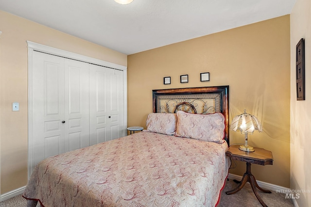 carpeted bedroom with a closet