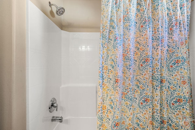 bathroom featuring shower / bath combo with shower curtain