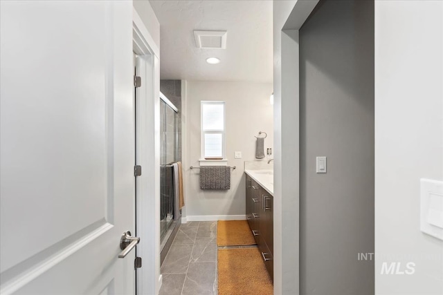 bathroom featuring vanity and walk in shower