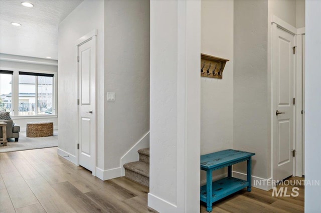 mudroom featuring recessed lighting, baseboards, and wood finished floors