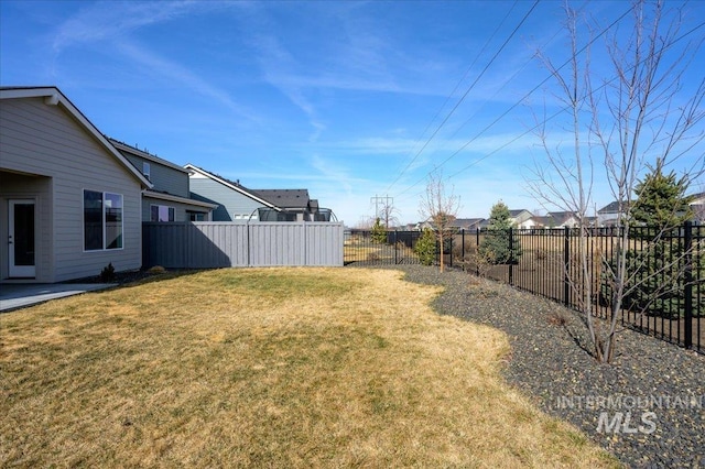 view of yard with a fenced backyard