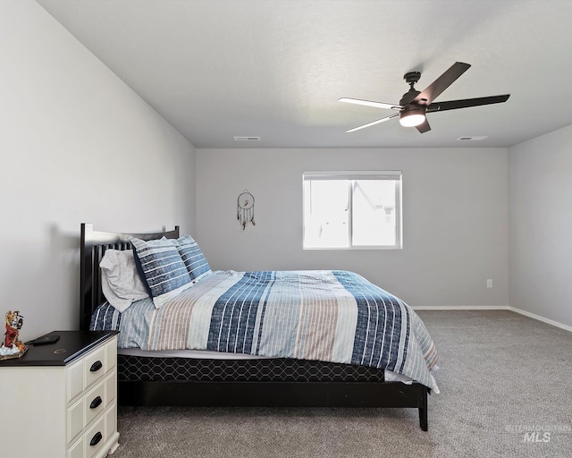 bedroom with carpet, visible vents, ceiling fan, and baseboards