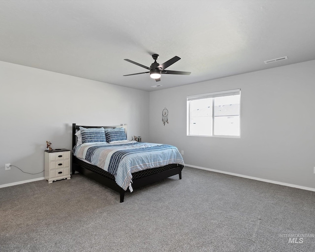 carpeted bedroom featuring visible vents, a ceiling fan, and baseboards