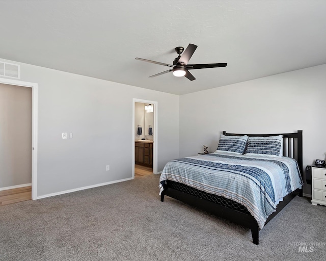 bedroom featuring light colored carpet, visible vents, and baseboards