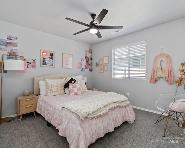 carpeted bedroom with baseboards, visible vents, and ceiling fan