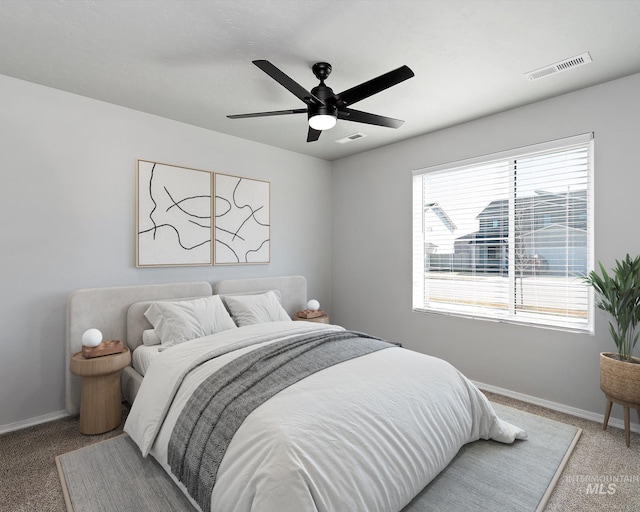 bedroom with a ceiling fan, baseboards, visible vents, and carpet flooring