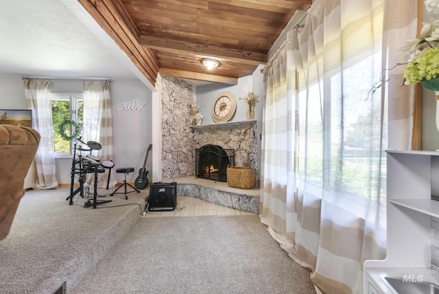 564 Blue Lakes Blvd, Twin Falls, ID 83301 - carpeted living room featuring wooden ceiling with exposed beams and a stone fireplace