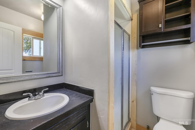 564 Blue Lakes Blvd, Twin Falls, ID 83301 - bathroom featuring toilet, a stall shower, and vanity