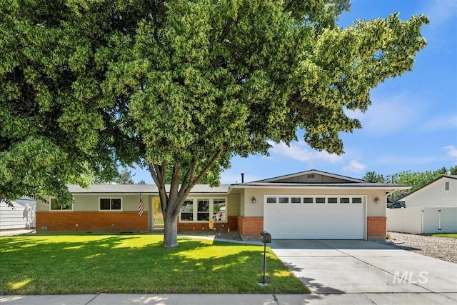 2230 N Camden, Boise, ID 83704 - ranch-style home featuring brick siding, a garage, and concrete driveway