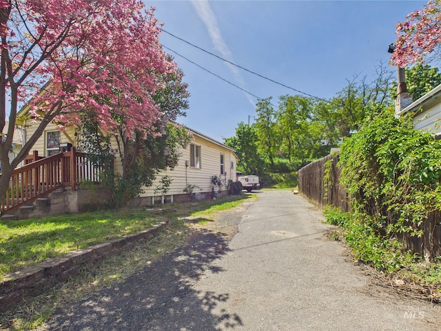 view of home's exterior featuring fence