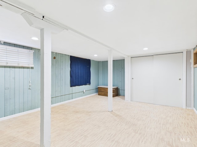 finished basement with recessed lighting, baseboards, and wood finished floors
