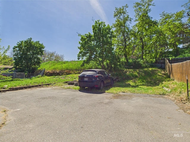 view of car parking with fence