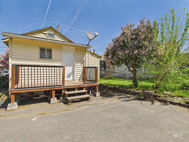 view of front of property with a wooden deck