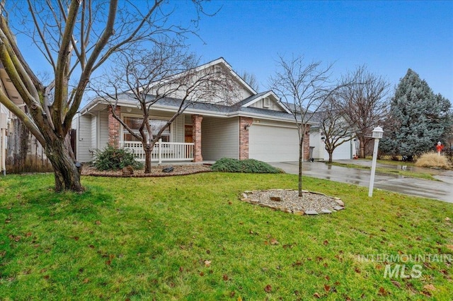 view of front of property featuring a garage, a porch, and a front yard