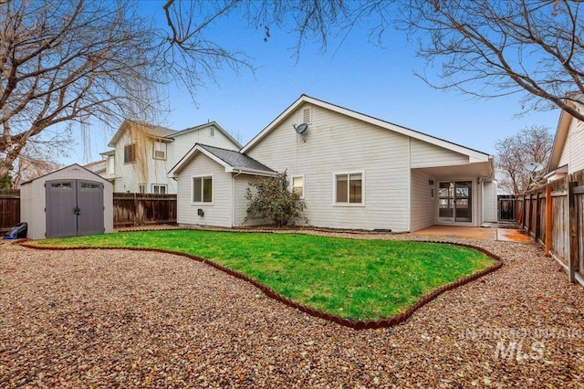 rear view of property featuring a patio area, a lawn, and a storage shed