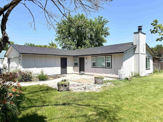 2104 S Chestnut St, Nampa, ID 83686 - ranch-style home featuring a front lawn, a chimney, roof with shingles, and board and batten siding
