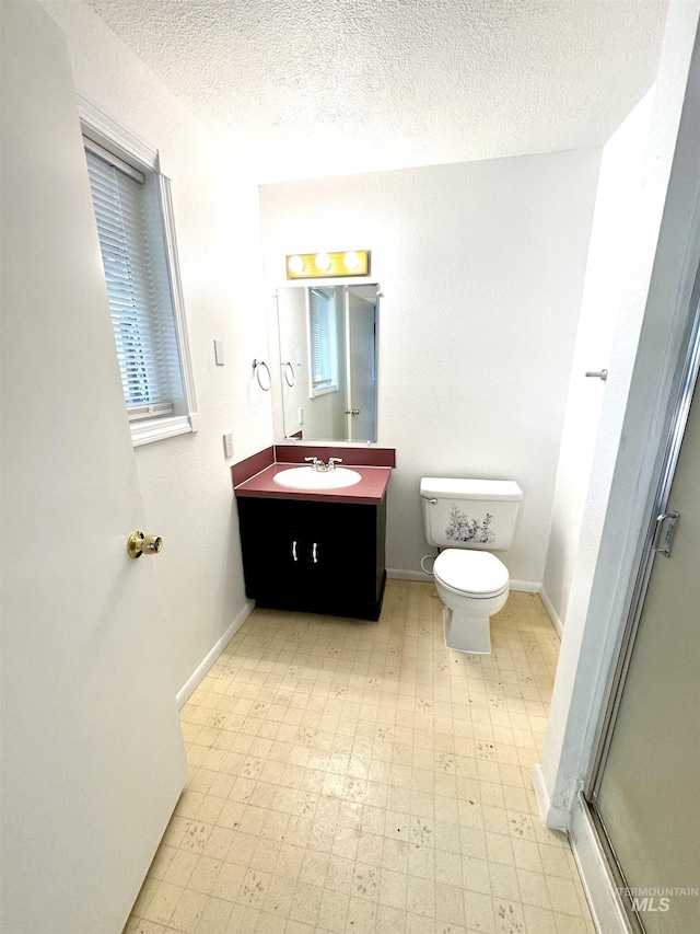 2104 S Chestnut St, Nampa, ID 83686 - bathroom with tile patterned floors, vanity, a textured ceiling, and a shower stall