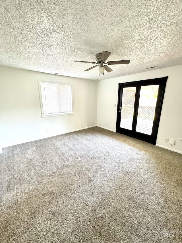 2104 S Chestnut St, Nampa, ID 83686 - spare room featuring plenty of natural light, carpet, ceiling fan, and a textured ceiling