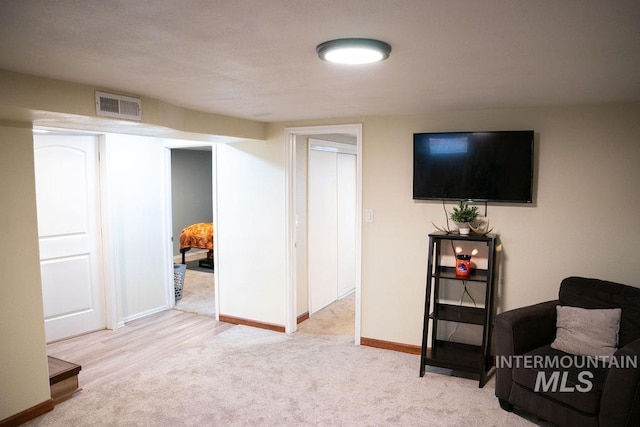 basement featuring light wood-type flooring