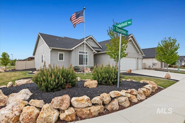 6545 E Thornton St, Nampa, ID 83687 - view of front facade featuring board and batten siding, an attached garage, fence, and concrete driveway