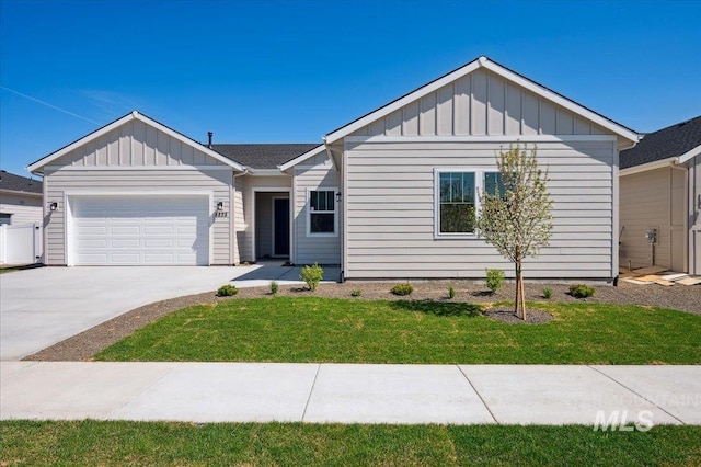 8828 S Waterclover Way, Meridian, ID 83642 - ranch-style home featuring board and batten siding, an attached garage, driveway, and a front yard