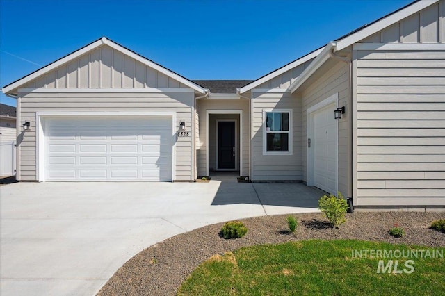8828 S Waterclover Way, Meridian, ID 83642 - single story home featuring board and batten siding, a garage, and concrete driveway