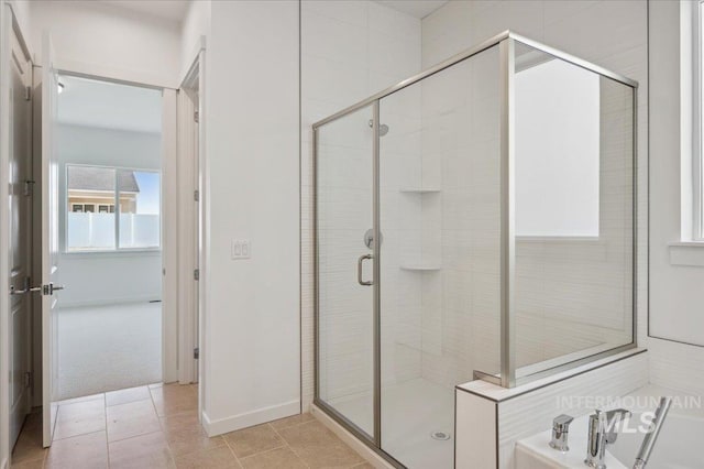 8828 S Waterclover Way, Meridian, ID 83642 - bathroom featuring a shower stall, a garden tub, and baseboards