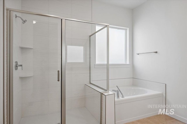 8828 S Waterclover Way, Meridian, ID 83642 - bathroom with a bath and a shower stall