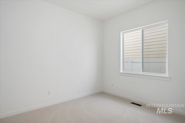 8828 S Waterclover Way, Meridian, ID 83642 - carpeted spare room with baseboards and plenty of natural light
