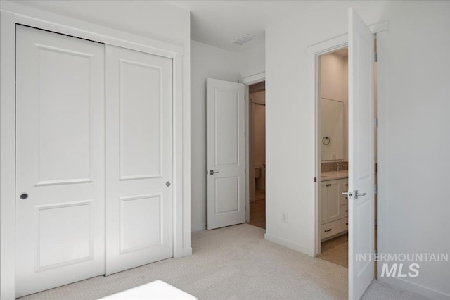 8828 S Waterclover Way, Meridian, ID 83642 - unfurnished bedroom featuring light colored carpet, a closet, ensuite bath, and baseboards