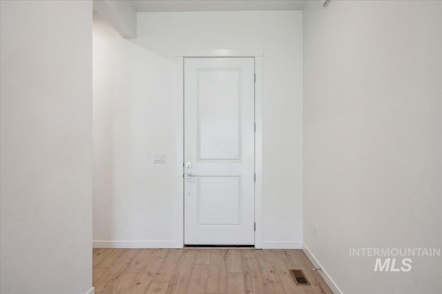 8828 S Waterclover Way, Meridian, ID 83642 - spare room featuring light wood-style flooring and baseboards