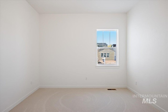 8828 S Waterclover Way, Meridian, ID 83642 - spare room featuring carpet flooring and baseboards