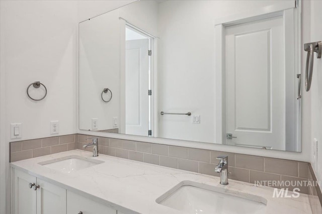 8828 S Waterclover Way, Meridian, ID 83642 - bathroom with decorative backsplash and double vanity