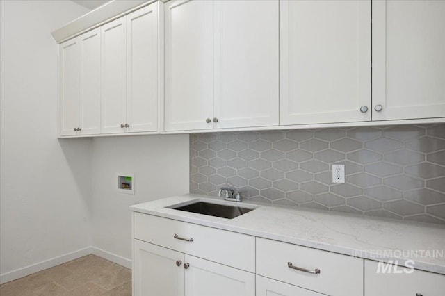 8828 S Waterclover Way, Meridian, ID 83642 - laundry area with cabinet space, hookup for a washing machine, and baseboards