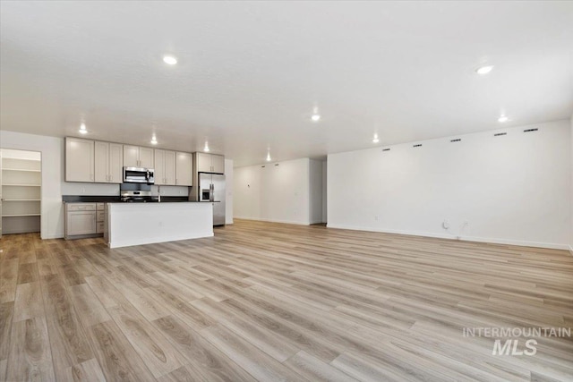 unfurnished living room featuring light wood-type flooring