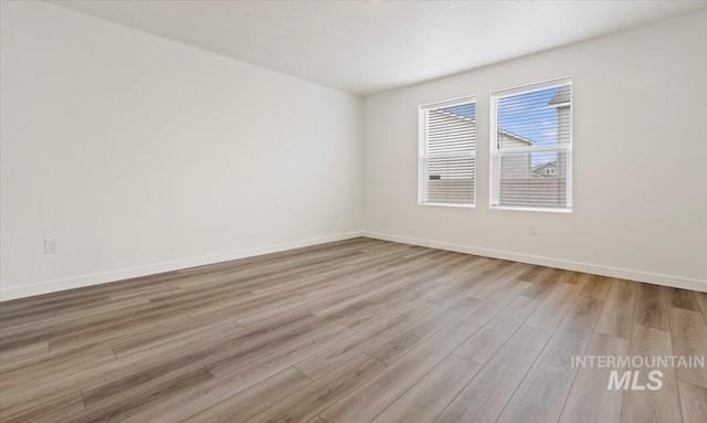 unfurnished room with light hardwood / wood-style floors