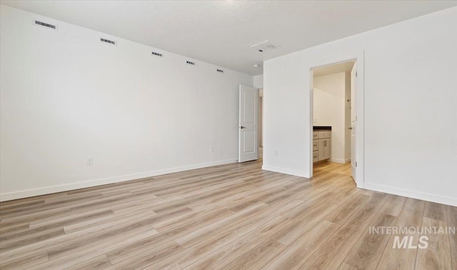 empty room featuring light hardwood / wood-style floors