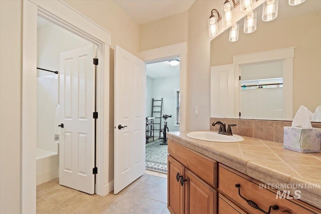 9740 W Shields Ave, Boise, ID 83714 - bathroom featuring vanity, tile patterned flooring, and shower / bath combination