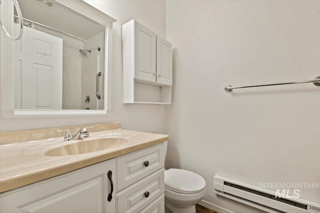 9740 W Shields Ave, Boise, ID 83714 - full bath with a baseboard heating unit, toilet, vanity, and a shower