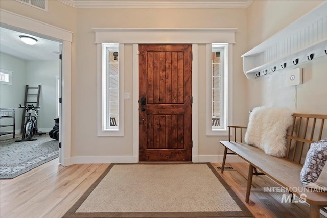 9740 W Shields Ave, Boise, ID 83714 - entrance foyer with light wood-style flooring, crown molding, and baseboards