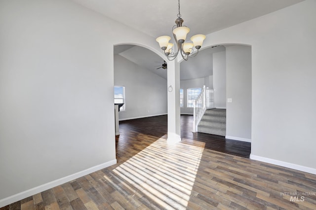 1095 Starlight Loop, Twin Falls, ID 83301 - unfurnished dining area featuring arched walkways, a ceiling fan, wood finished floors, and lofted ceiling