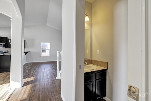 1095 Starlight Loop, Twin Falls, ID 83301 - bathroom with vanity, vaulted ceiling, and wood finished floors