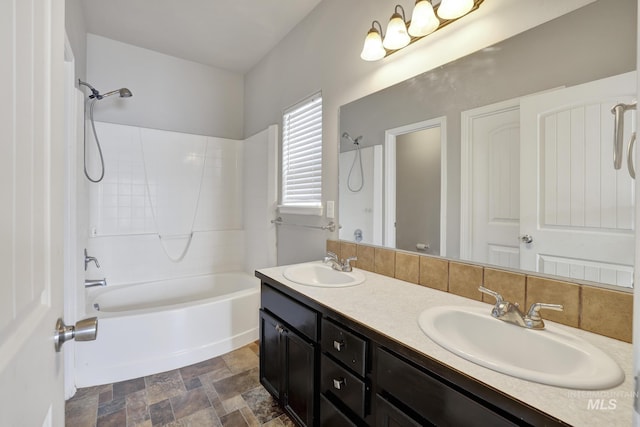 1095 Starlight Loop, Twin Falls, ID 83301 - bathroom with shower / bathtub combination, double vanity, and stone finish flooring