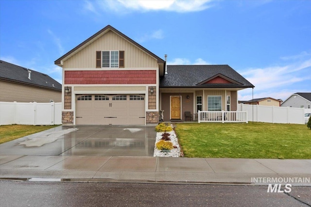 1095 Starlight Loop, Twin Falls, ID 83301 - craftsman-style home with stone siding, a porch, concrete driveway, and an attached garage