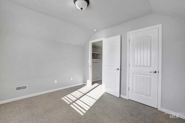 1095 Starlight Loop, Twin Falls, ID 83301 - unfurnished bedroom with vaulted ceiling, carpet floors, a walk in closet, and a closet