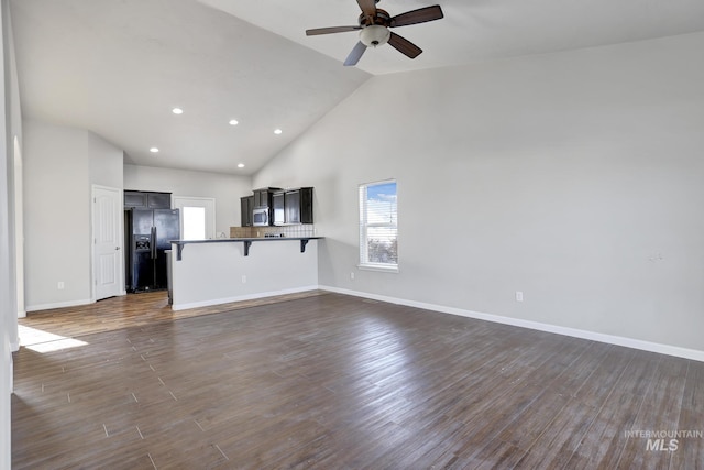 1095 Starlight Loop, Twin Falls, ID 83301 - unfurnished living room with ceiling fan, high vaulted ceiling, dark wood-type flooring, and recessed lighting