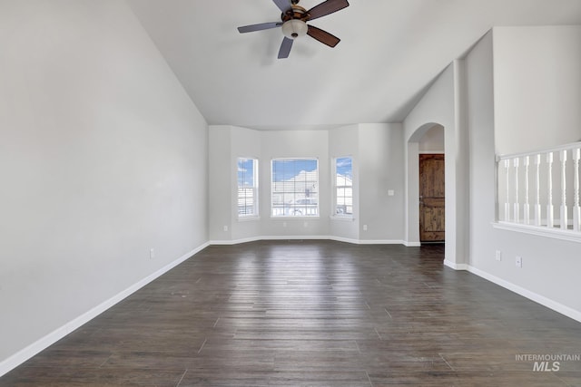 1095 Starlight Loop, Twin Falls, ID 83301 - unfurnished room featuring lofted ceiling, a ceiling fan, arched walkways, and dark wood-type flooring