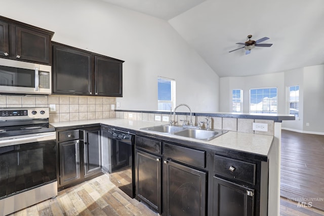 1095 Starlight Loop, Twin Falls, ID 83301 - kitchen with appliances with stainless steel finishes, light wood-style floors, a ceiling fan, light countertops, and high vaulted ceiling