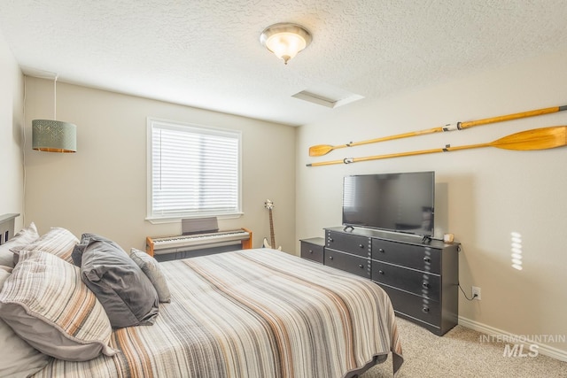 carpeted bedroom with a textured ceiling