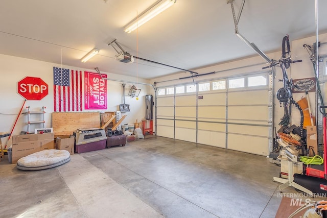 garage featuring a garage door opener and electric panel